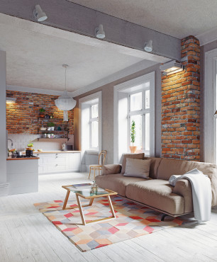 Graues Wohnzimmer mit Holzboden und Backstein an der Wand