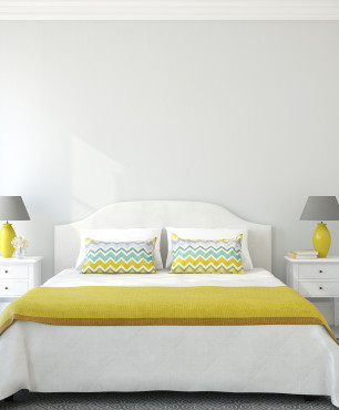 Schlafzimmer mit gelben und grauen Accessoires